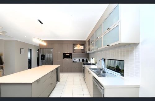 Bushland Beach House | Modern Coastal Home Luxury Stay in Bushland Beach QLD 4818