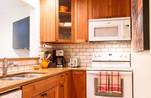Glacier Condo | Modern Condo by the River: Pool, Spa & Pet-Friendly Stays