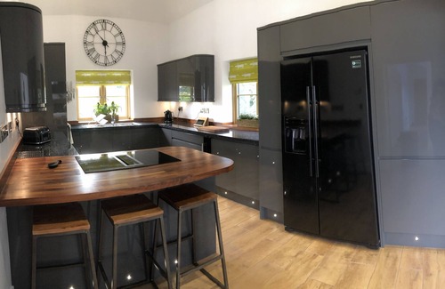 Haverfordwest Cabin | Stylish Converted Stables with Spa and Ocean Views in Pembrokeshire
