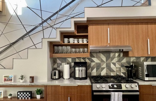 Holly House | Modern Downtown Retreat with Hot Tub and King Bed