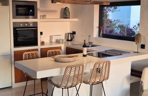 Cala Vadella Apartment | Ocean View Retreat: 9.6/10 Rated with Beachfront Amenities