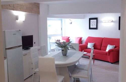 Comarruga Apartment | Coastal Escape: Beachfront Apartment with Air Conditioning
