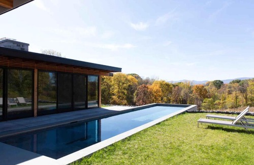 Hudson House | Modern Glass House Retreat with Pool & Catskill Views