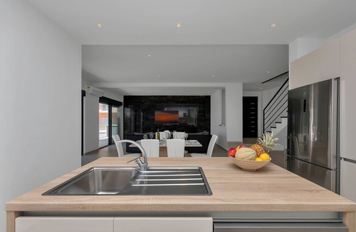 Bast House | Modern Holiday Home with Infinity Pool and Sea View