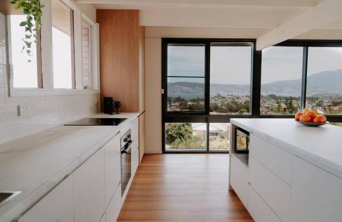 Howrah Apartment | Modern Retreat with River Views and Hot Tub Amenities