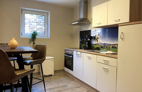 Dausfeld Apartment | Modern Junior Suite with Kitchen and Garden Terrace Oasis