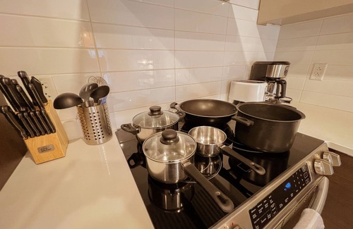 Monkland Village Condo | Modern King Suite with WiFi, Gym & Terrace Near Downtown