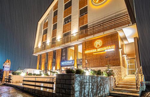 Kolasin Hotel | Modern Mountain Retreat: Family-Friendly & Hot Tub Access