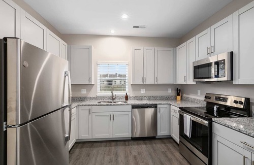 Grandville Condo | Modern 2BR Condo with Garage, Patio & Pet-Friendly Amenities