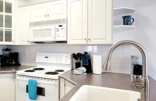 East Kootenay Condo | Serene Walkout Suite at Riverside Golf Course with Spa