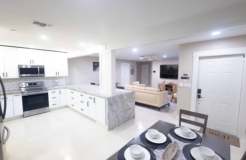 Garden Isles House | Stylish Poolside Retreat Steps from Beach and Golfing