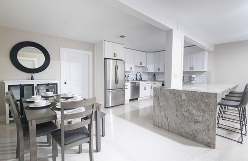Garden Isles House | Stylish Poolside Retreat Steps from Beach and Golfing
