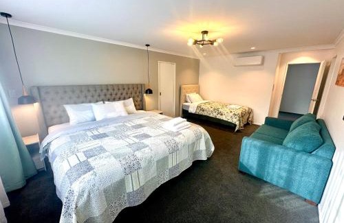 Rosedale House | Modern Private Deluxe Master Suite California Bed and Bathtub