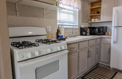 Wyandotte House | Modern River Retreat: Ideal Getaway with Spa & Hot Tub
