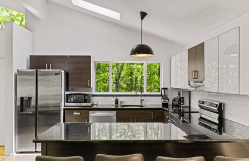 Bushkill House | Contemporary Streamfront Retreat with Spa and Hot Tub