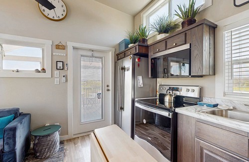 Fredericksburg House | Modern tiny home with loft, kitchen, cozy patio and shared pools, great location