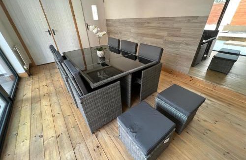 Roughton House | Trendy Upside Down Retreat with Hot Tub & Family-Friendly Perks
