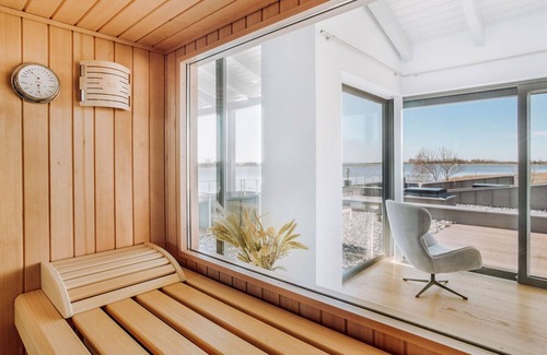 Waase Apartment | Modern Bodden Apartment with Sauna, Fireplace & Pool