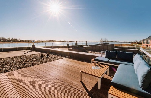 Waase Apartment | Modern Bodden Apartment with Sauna, Fireplace & Pool