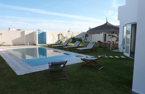 Aghir Villa | Modern Villa with Pool and Ocean View Steps from the Beach