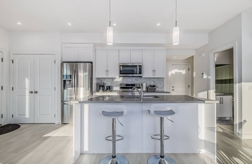 Airdrie House | Stylish Waterfront Retreat with Scenic Canal Views