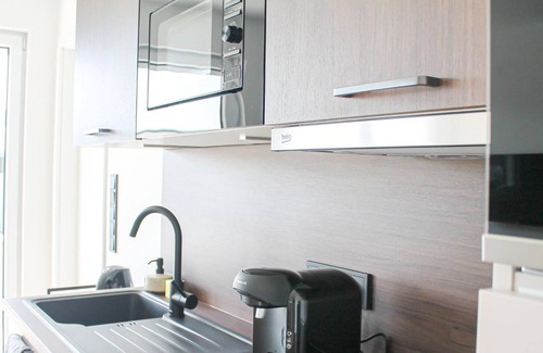 Goldgrube Apartment | Modern Hotel Near City Center with Balcony & Spa Amenities