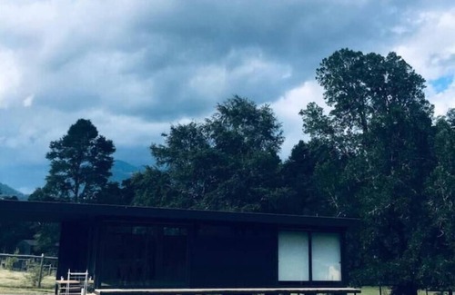 Pucon House | Cozy Riverfront Retreat with Spa and Breakfast Included