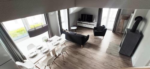 Trossingen Apartment | Modern Retreat with Fireplace and Rooftop Terrace