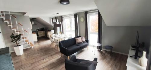 Trossingen Apartment | Modern Retreat with Fireplace and Rooftop Terrace