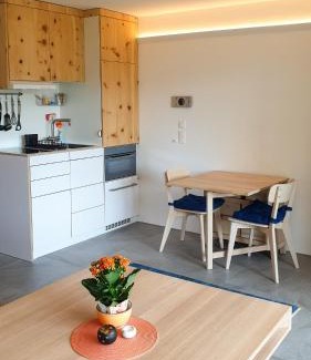 Champfer Apartment | Modern Alpine Studio with Pool and Mountain Views