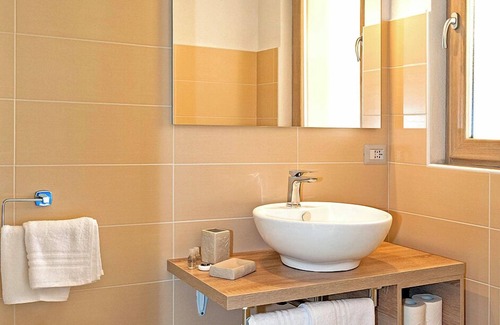 San Teodoro House | Cozy Molarotto Rooms with Kitchenette and Pool Access
