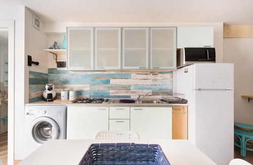 San Pietro in Bevagna Apartment | Experience Comfort at 2184 Mono Chicca Blu with Ocean Views