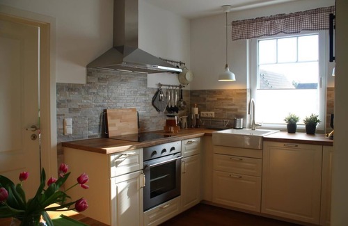 Born auf dem Darss Apartment | Sunlit Retreat with Balcony, Barbecue & Steps to the Sea