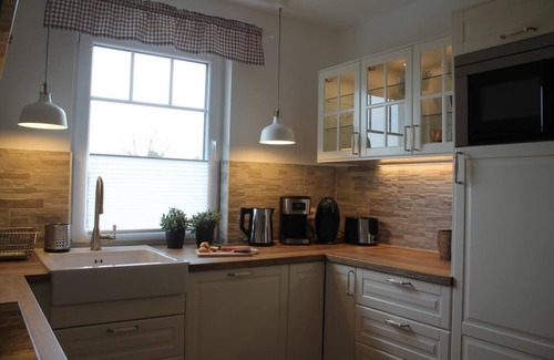 Born auf dem Darss Apartment | Sunlit Retreat with Balcony, Barbecue & Steps to the Sea