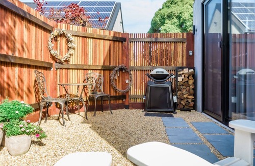 Flinders Apartment | Morradoo Studio - Unwind by the cozy fireplace with firewood.