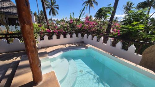 Pwani Mchangani Apartment | Top Floor Oceanfront Apartment with Pool & Beach Access