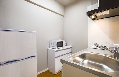 Makishi Apartment | Discover Mr.KINJO in ARCADE ANGE MIONA with Ocean Views