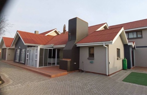 Walvis Bay House | Discover Mucha's Guest House: Pet-Friendly & Relaxing Retreat