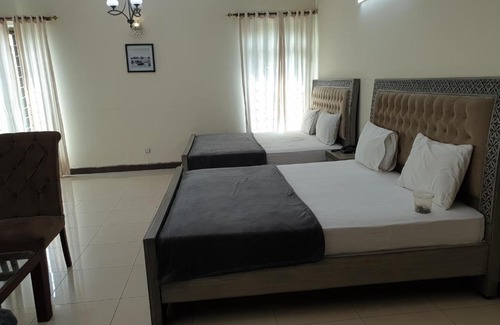 E-11 Sector House | Inviting Mudan Regency Guest House with Family-Friendly Perks