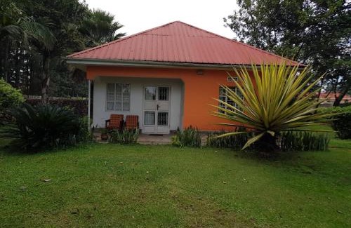 Western Region House | Inviting Mutolere Coffee Pot Guest Houses with Fireplace & Dining