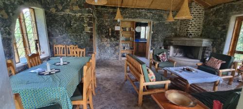 Western Region House | Inviting Mutolere Coffee Pot Guest Houses with Fireplace & Dining