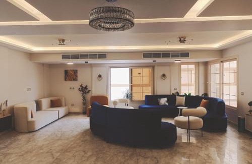 Sheikh Zayed City Apartment | Experience My Villa: 4-Star Stay with Pool & Breakfast