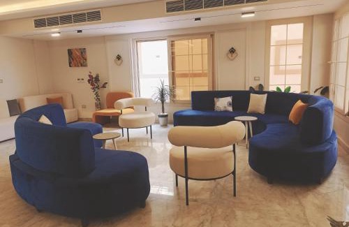 Sheikh Zayed City Apartment | Experience My Villa: 4-Star Stay with Pool & Breakfast