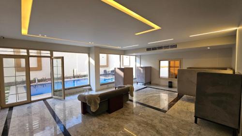 Sheikh Zayed City Apartment | Experience My Villa: 4-Star Stay with Pool & Breakfast