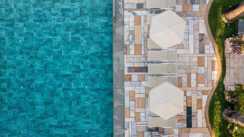 Tingaki Apartment | Discover Mythos Suites Hotel with Oceanfront Views