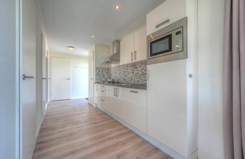 Municipality of Hellevoetsluis House | Cozy Chalet with 3 Bedrooms and Pet-Friendly Terrace