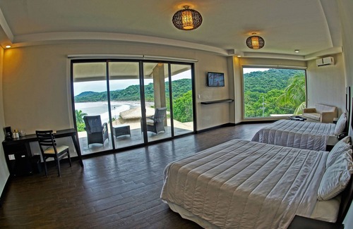 Puerto Carrillo Hotel | Relax at Nammbú Beachfront Bungalows with Pool & Spa