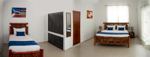 Caleta Cruz Hotel | Relax at Nauti-k Beach Hotel with Oceanfront Views