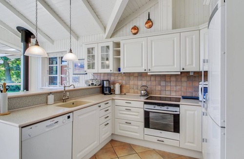 Grena Strand House | Beachside Escape: Nela with Ocean View & Spa Amenities