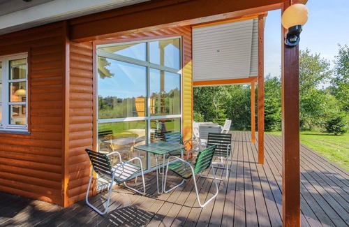 Grena Strand House | Beachside Escape: Nela with Ocean View & Spa Amenities